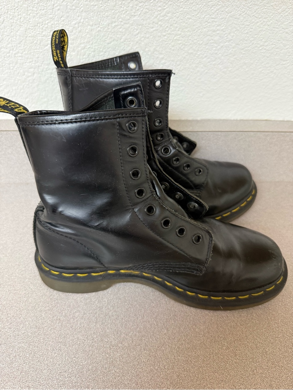 Dr. Martens Kids Black Leather Combat Boots with Yellow Stitching